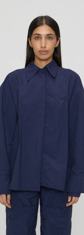 A woman wearing navy blue marie shirt