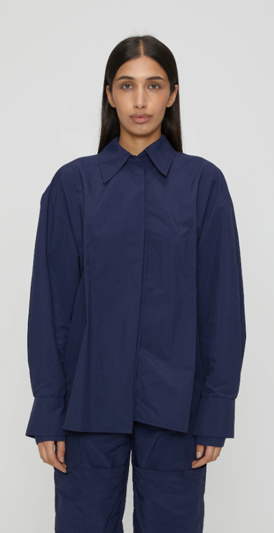 A woman wearing navy blue marie shirt