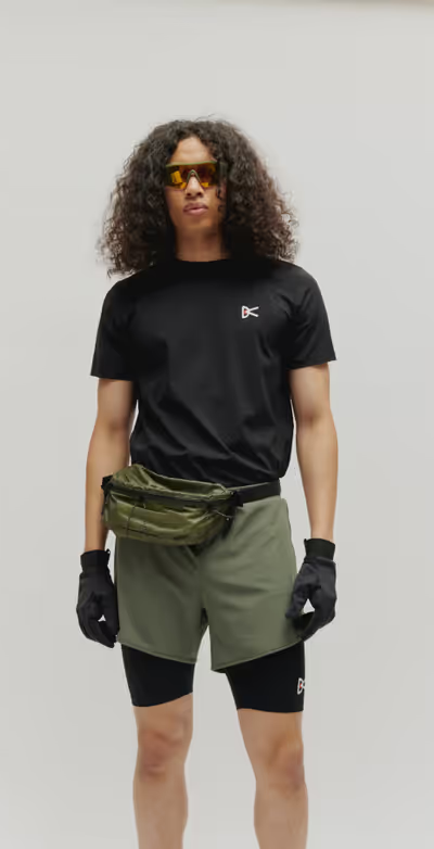 A man wearing ultralight aloe short sleeve black tee