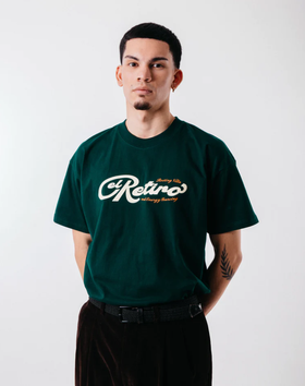 A man wearing green "El retiro" tee