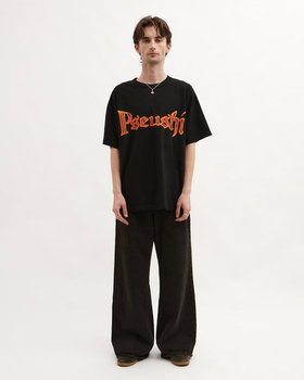 A man wearing black blacksmith t-shirt