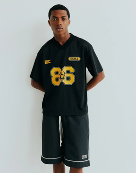 A man wearing black championship mesh jersey