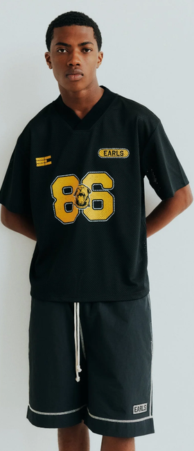 A man wearing black championship mesh jersey