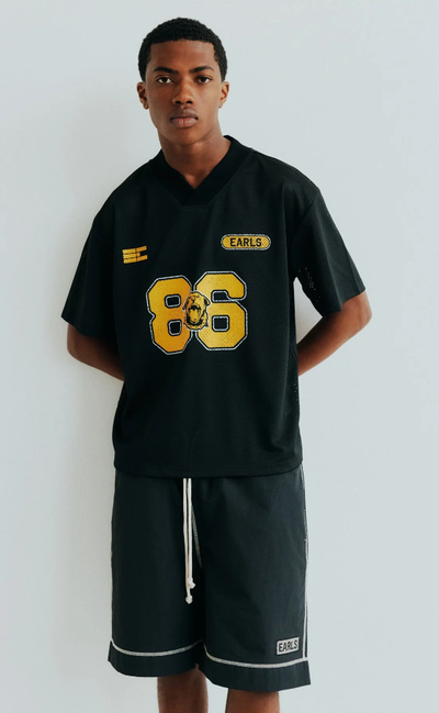 A man wearing black championship mesh jersey