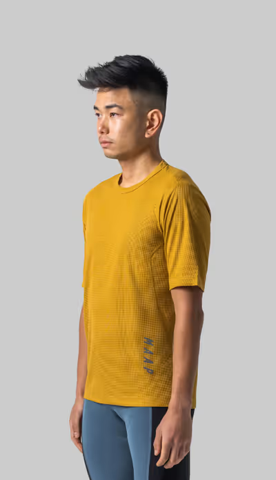A man wearing honey color t-shirt