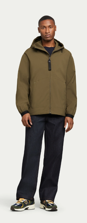 A man wearing olive pace hoodie