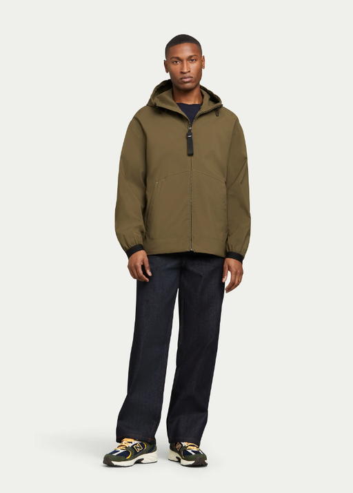 A man wearing olive pace hoodie