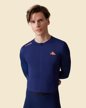 A man wearing navy superlight cycling jersey