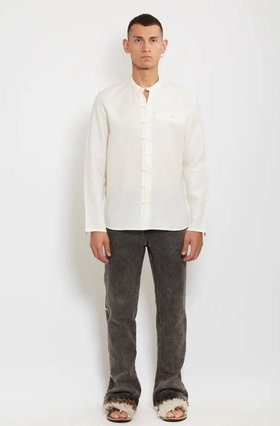 A man wearing gacho: ivory linen shirt