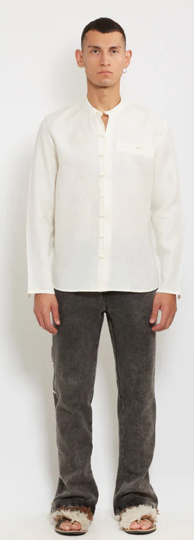 A man wearing gacho: ivory linen shirt