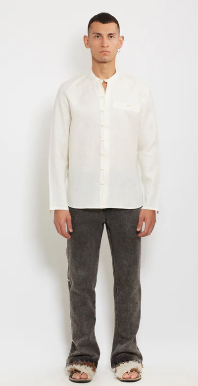A man wearing gacho: ivory linen shirt