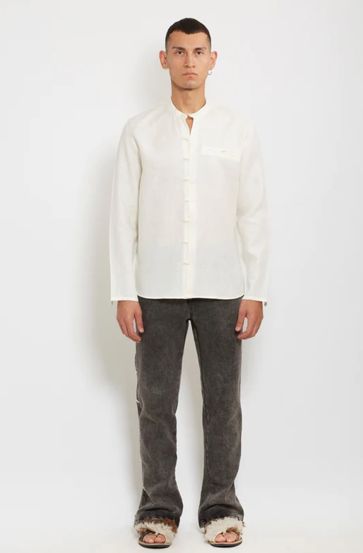 A man wearing gacho: ivory linen shirt
