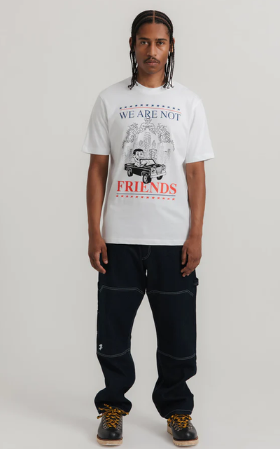A man wearing white carcetti 4 president tee