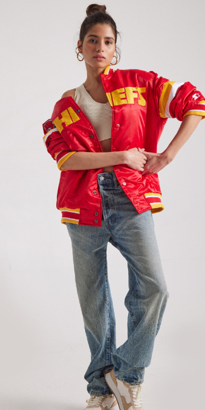 A woman wearing a red super bowl showdown jacket