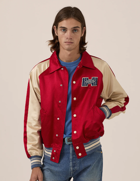 A man wearing red varsity jacket