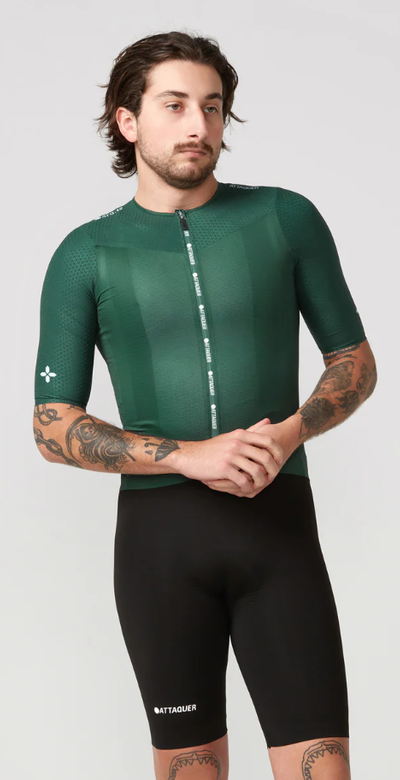 A man wearing ultra+ aero jersey deep green