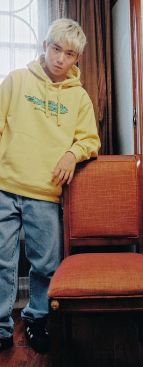 A man wearing yellow hoodie