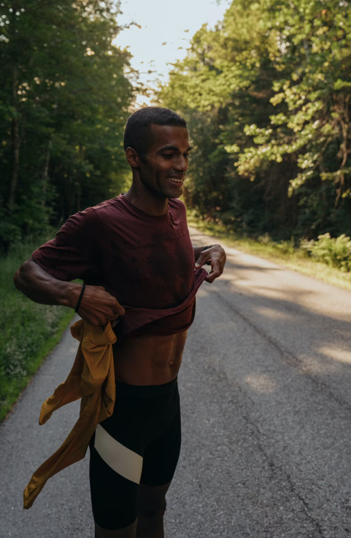 A man wearing berry color harrier t-shirt