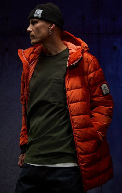 A man wearing orange jacket