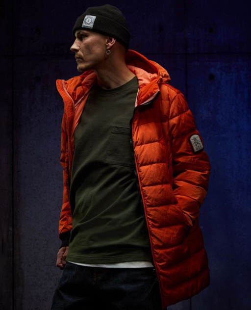 A man wearing orange jacket