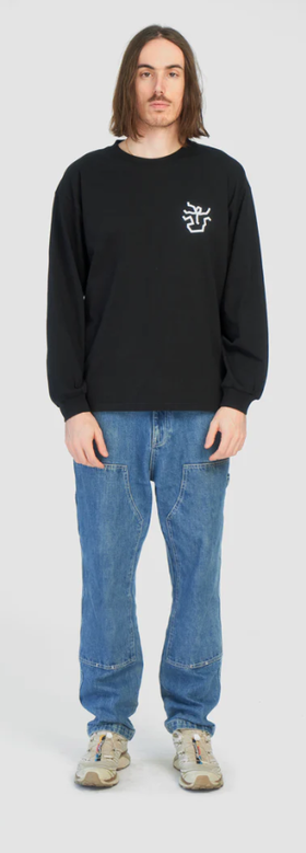 A man wearing black falling apart long t-shirt