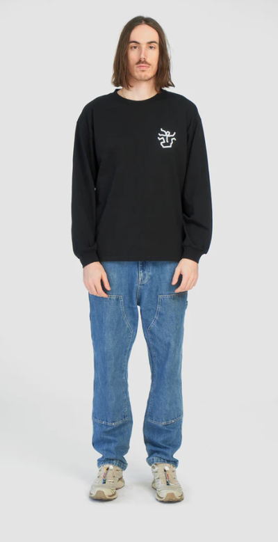 A man wearing black falling apart long t-shirt