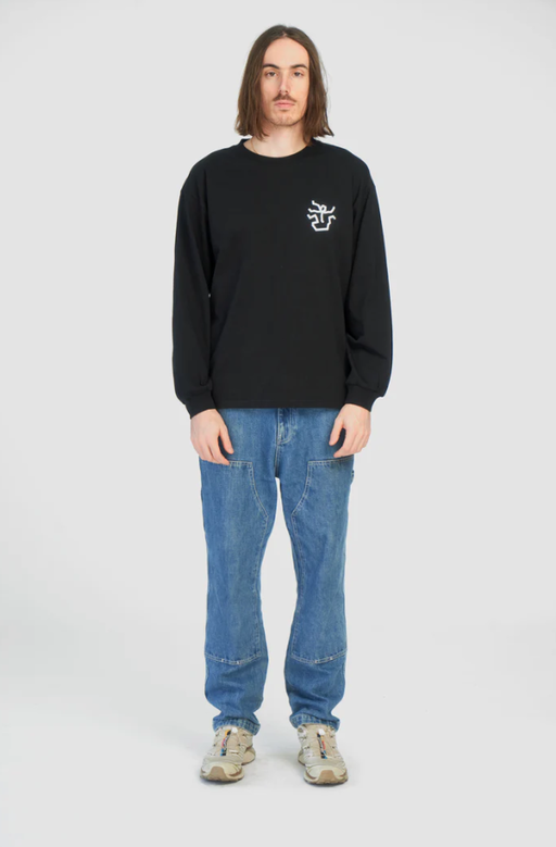 A man wearing black falling apart long t-shirt