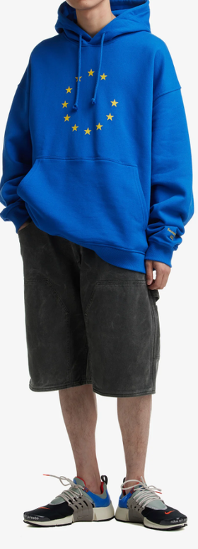 A man wearing eunify blue hoodie