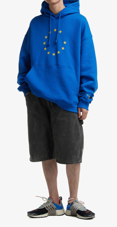 A man wearing eunify blue hoodie