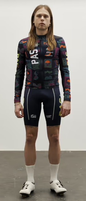 A man wearing multi color stfr mechanism long sleeve jersey