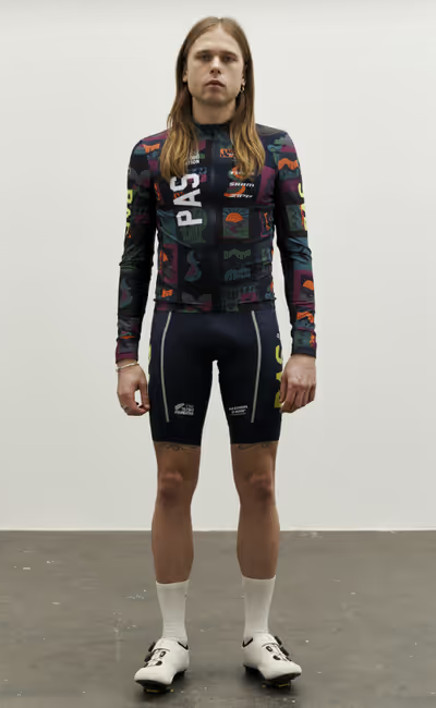 A man wearing multi color stfr mechanism long sleeve jersey