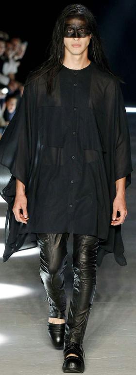 A runway model wearing an Alexandre Plokhov all black outfit