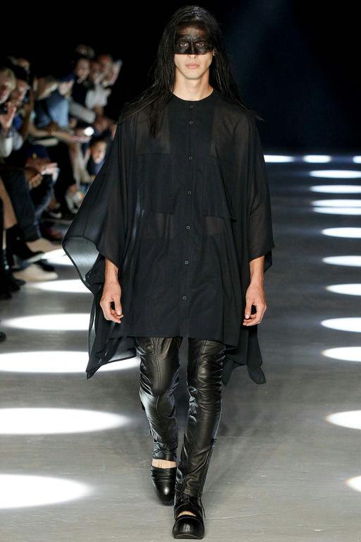 A runway model wearing an Alexandre Plokhov all black outfit