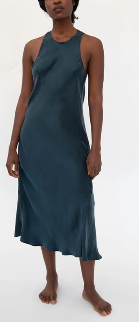 A woman wearing gia sandwashed cupro vegan silk sleep dress