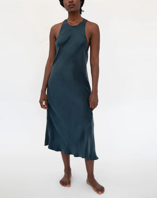 A woman wearing gia sandwashed cupro vegan silk sleep dress