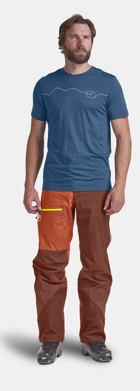 A man wearing mountain blue t-shirt
