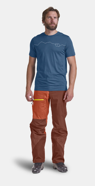 A man wearing mountain blue t-shirt
