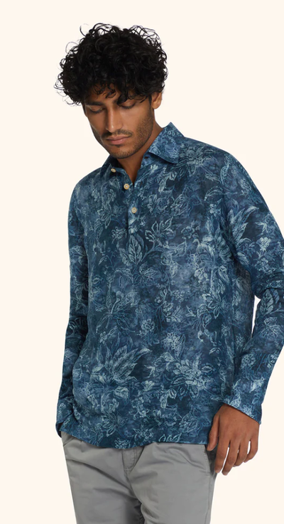A man wearing ink blue floral-print ''positano'' polo shirt