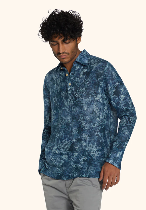 A man wearing ink blue floral-print ''positano'' polo shirt