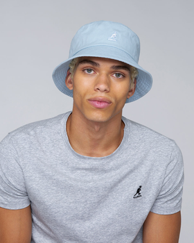 A man wearing a blue washed bucket hat