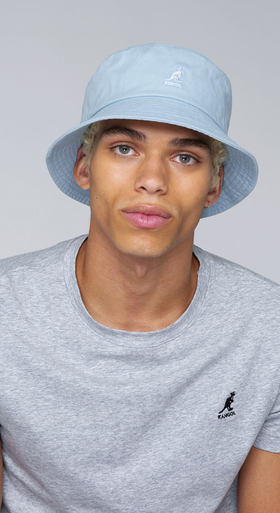 A man wearing a blue washed bucket hat