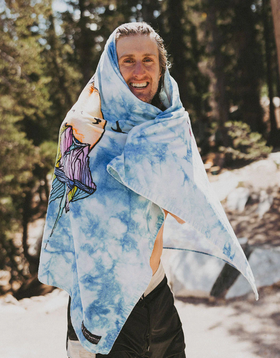 A man wearing chris benchetler beach eco towel