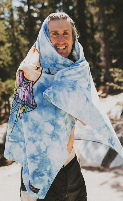 A man wearing chris benchetler beach eco towel