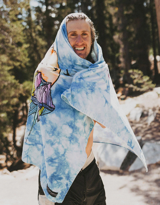 A man wearing chris benchetler beach eco towel