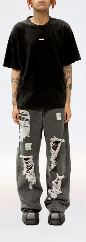A man wearing a Stolen Girlfriends Club metal hardware tee