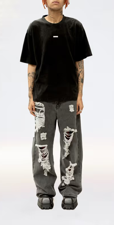 A man wearing a Stolen Girlfriends Club metal hardware tee