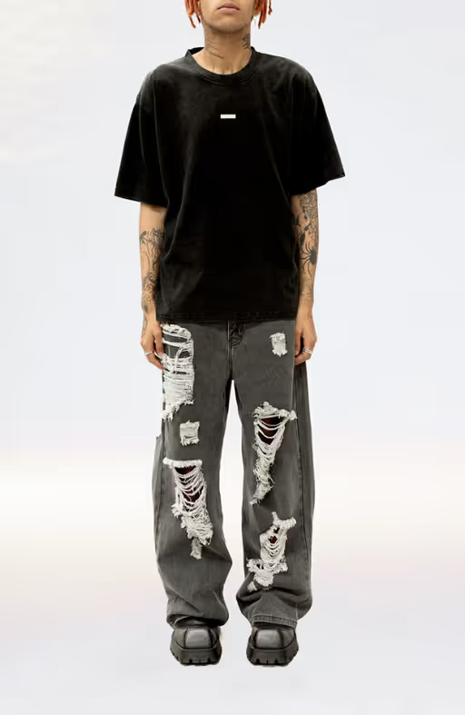 A man wearing a Stolen Girlfriends Club metal hardware tee