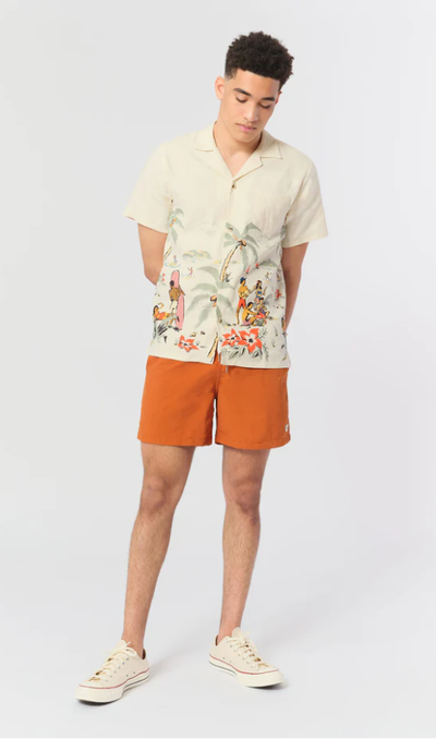 A man wearing a Bather solid ginger swim trunk