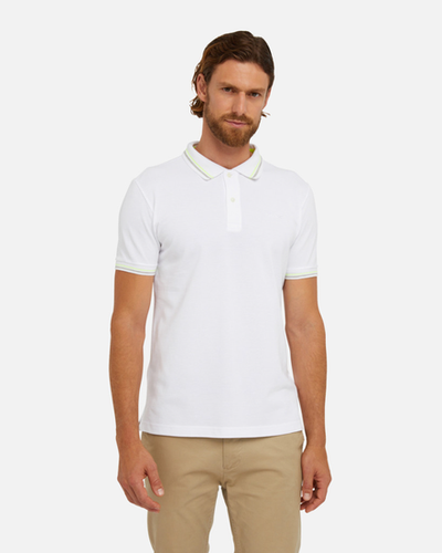 A man wearing white polo shirt