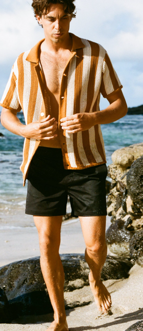 A man wearing the mallorca swim-walk short - onyx